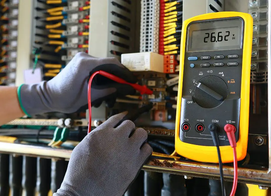 electrician using voltmeter
