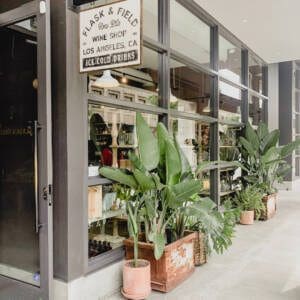 outdoor store front with lots of plants