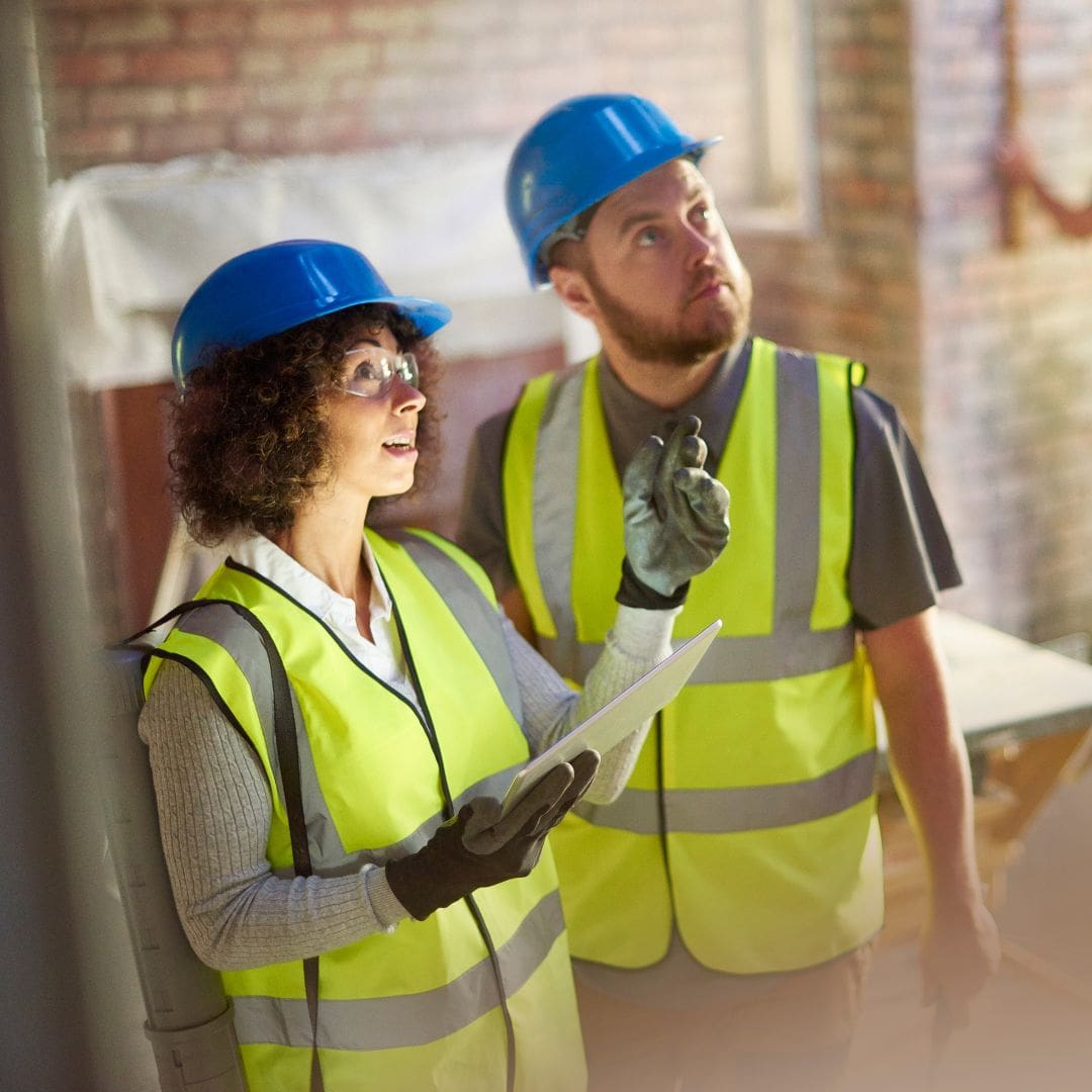 Two contractors looking at construction build