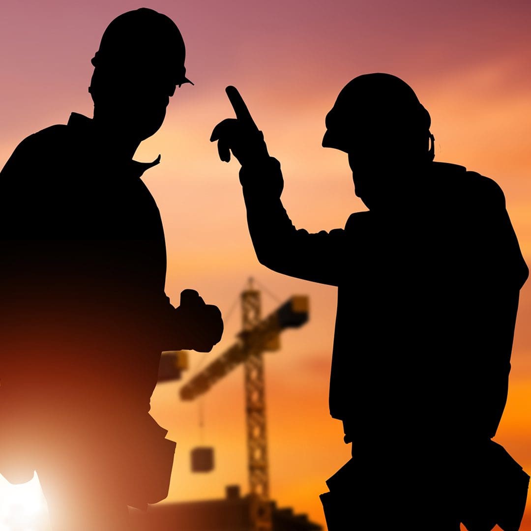 silhouette of contractors talking