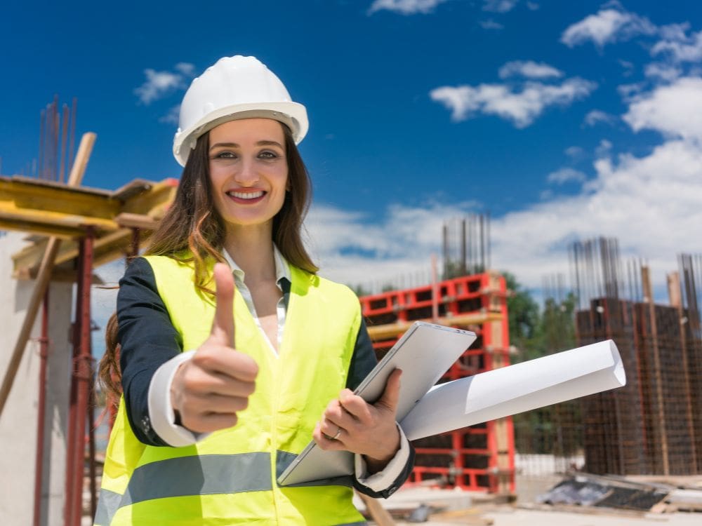 a construction woman worker holding thumbs up